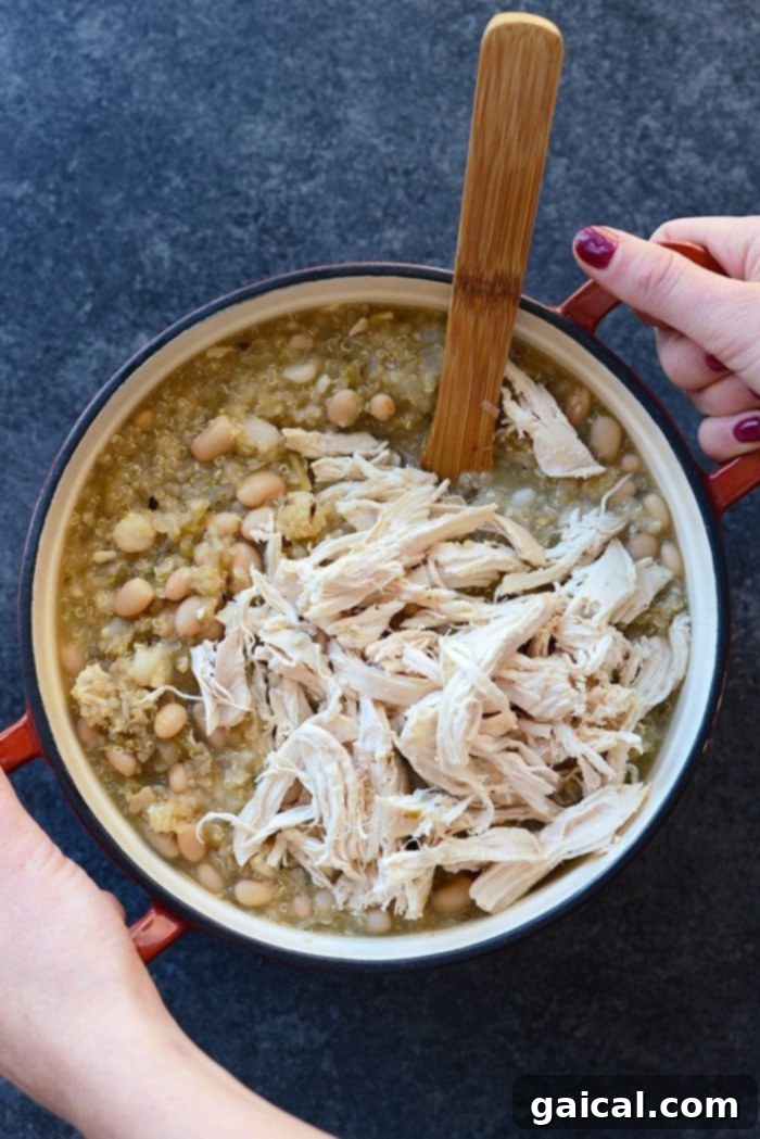 Wholesome White Chicken Quinoa Chili 3 Close-up of the delicious White Chicken Quinoa Chili, highlighting the tender chicken, quinoa, and creamy beans, ready to be topped.