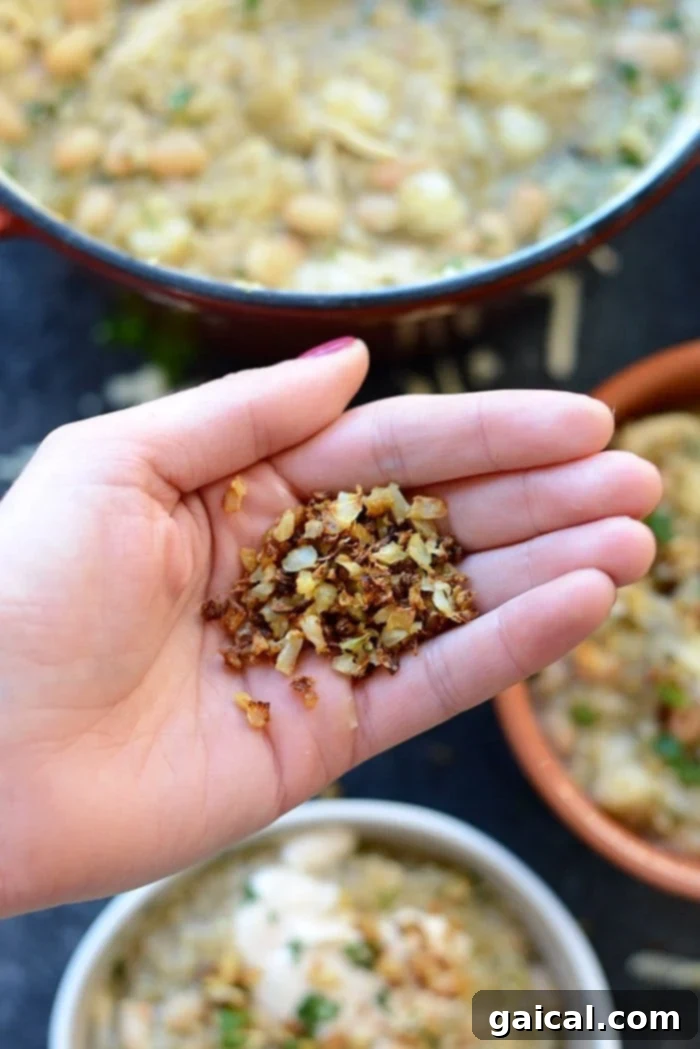Wholesome White Chicken Quinoa Chili 5 Multiple bowls of White Chicken Quinoa Chili neatly arranged, ready for serving or meal prepping, showcasing the hearty ingredients.