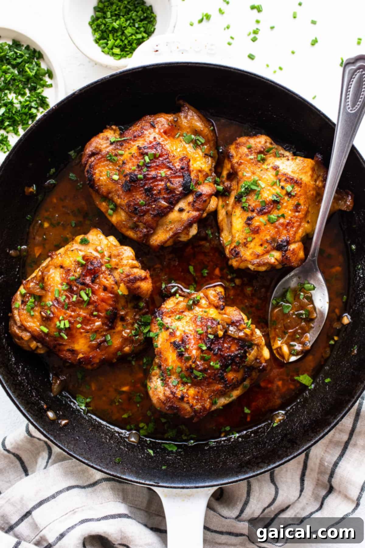 Crispy Cast Iron Chicken Thighs with fresh herbs