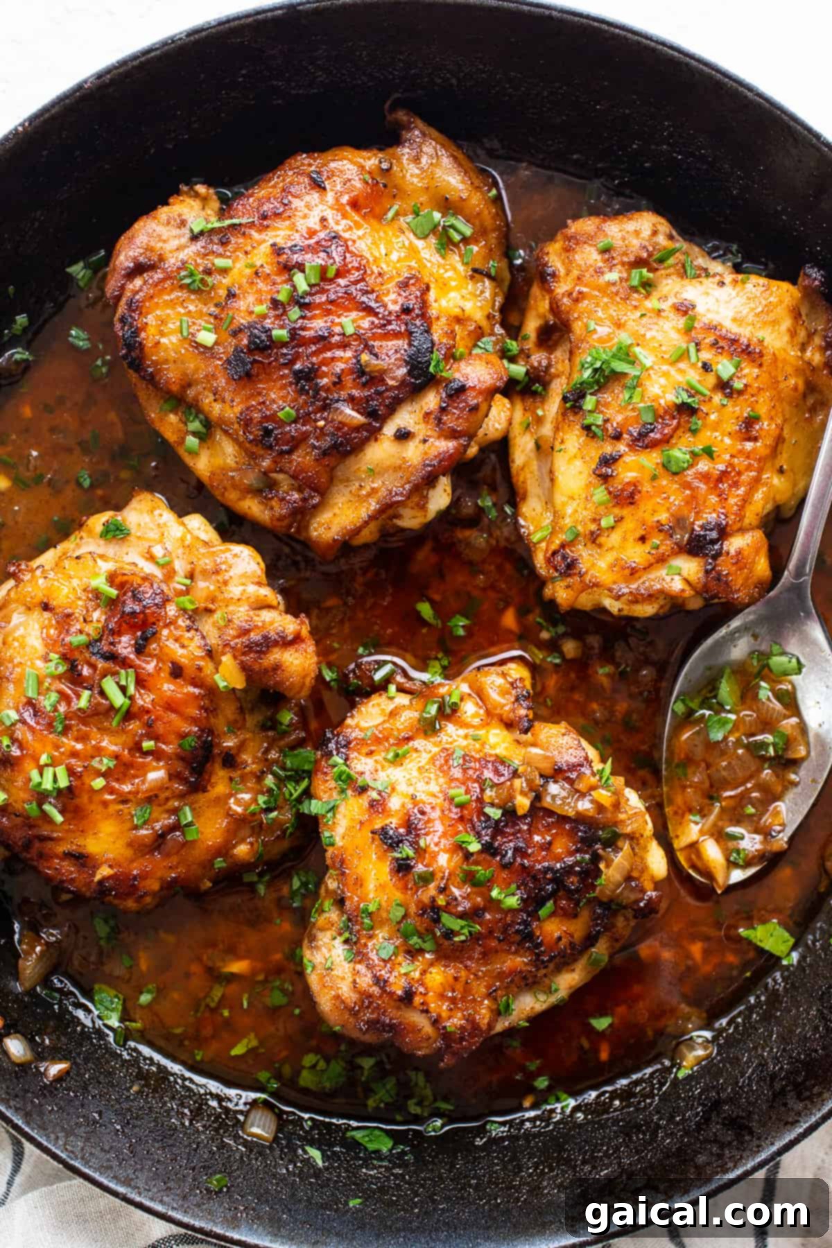 Chicken thighs in a rich pan sauce with fresh chives