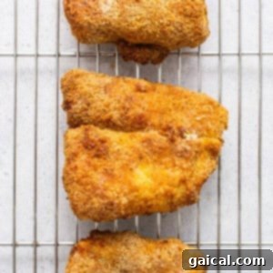 Air fryer fish on a cooling rack.