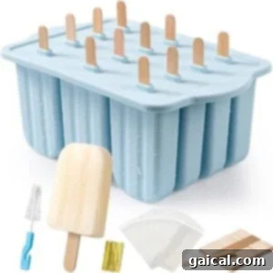 Protein-Packed Strawberry Shortcake Ice Cream Bars 4 A blue box containing ice pop molds, popsicle sticks, and a spatula, suggesting tools for making homemade frozen treats.
