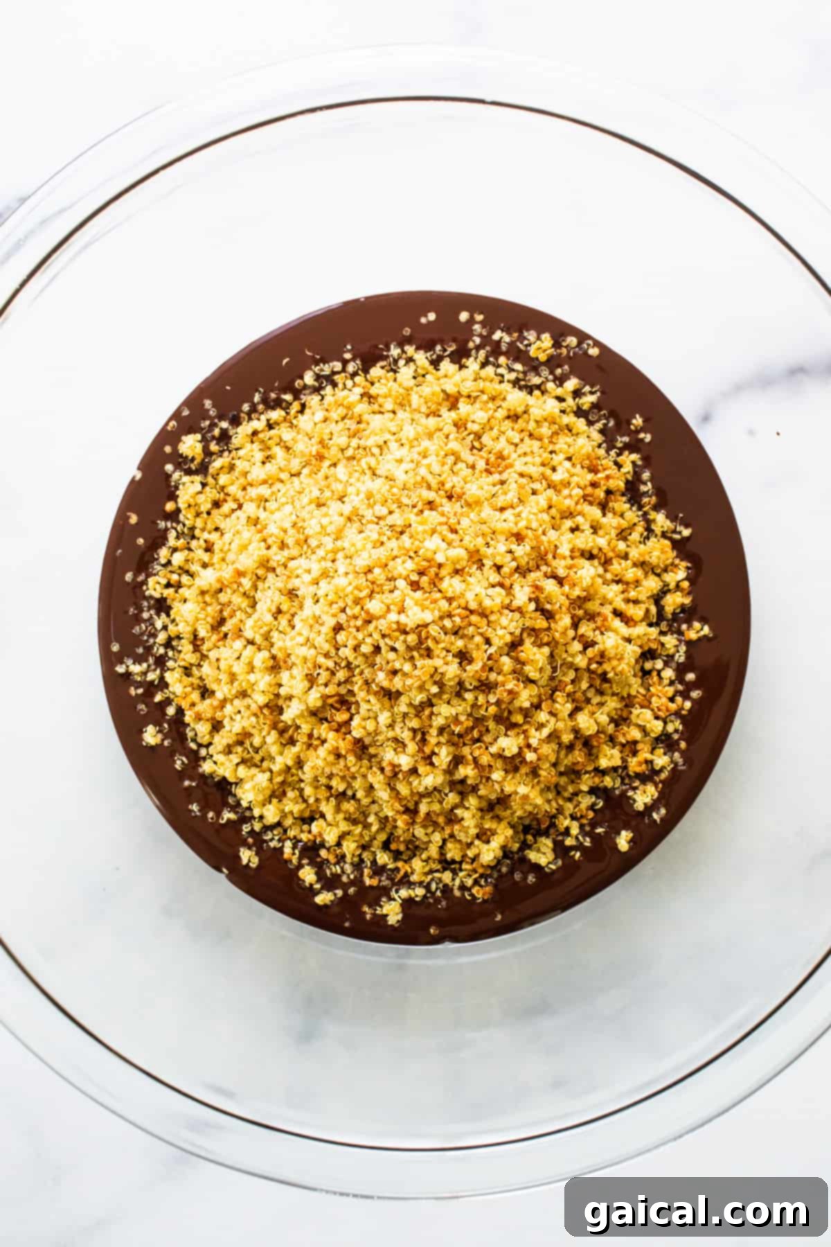 A close-up shot of the simple, high-quality ingredients laid out beautifully for making chocolate quinoa crisps, highlighting freshness and readiness.
