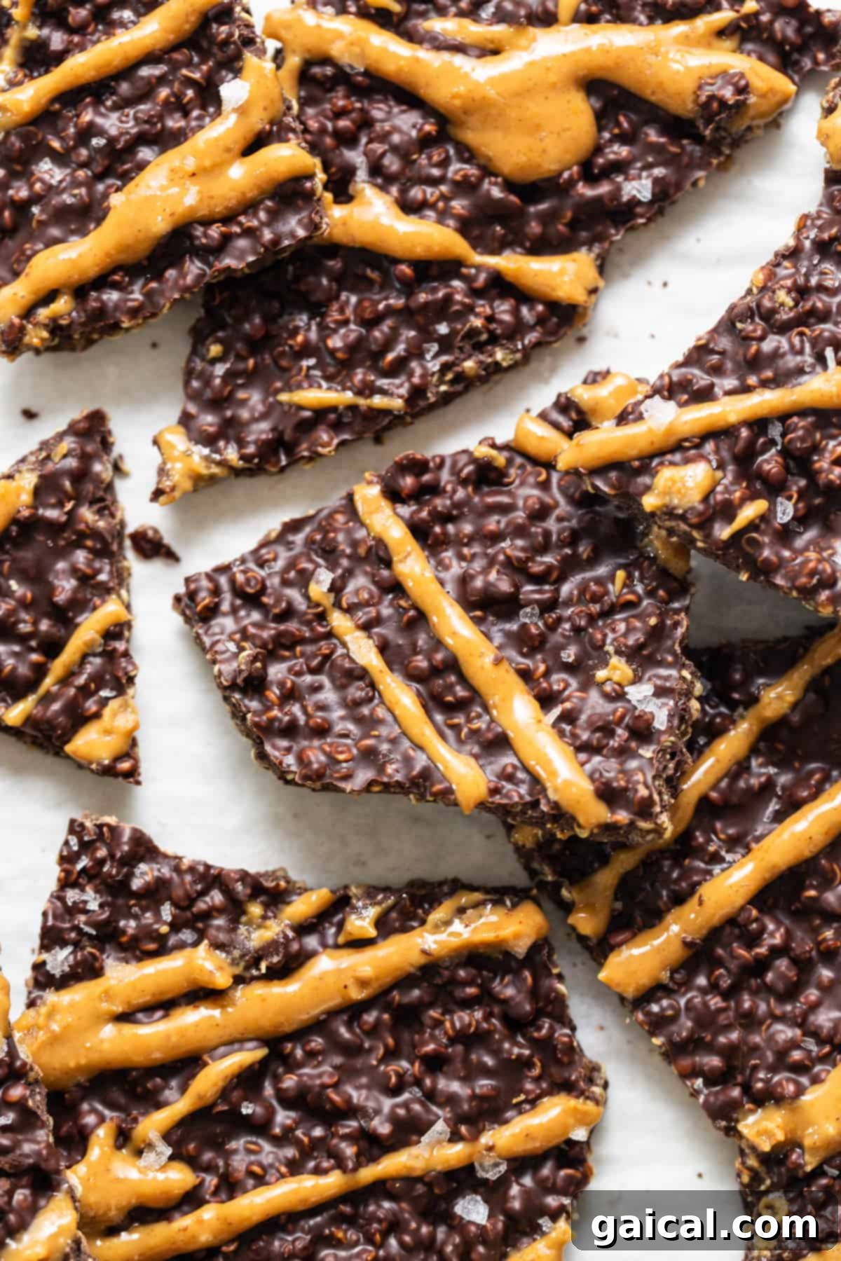 A close-up of a freshly made batch of chocolate quinoa crisps, showing off their perfect texture and delicious, appealing appearance on a cooling rack.