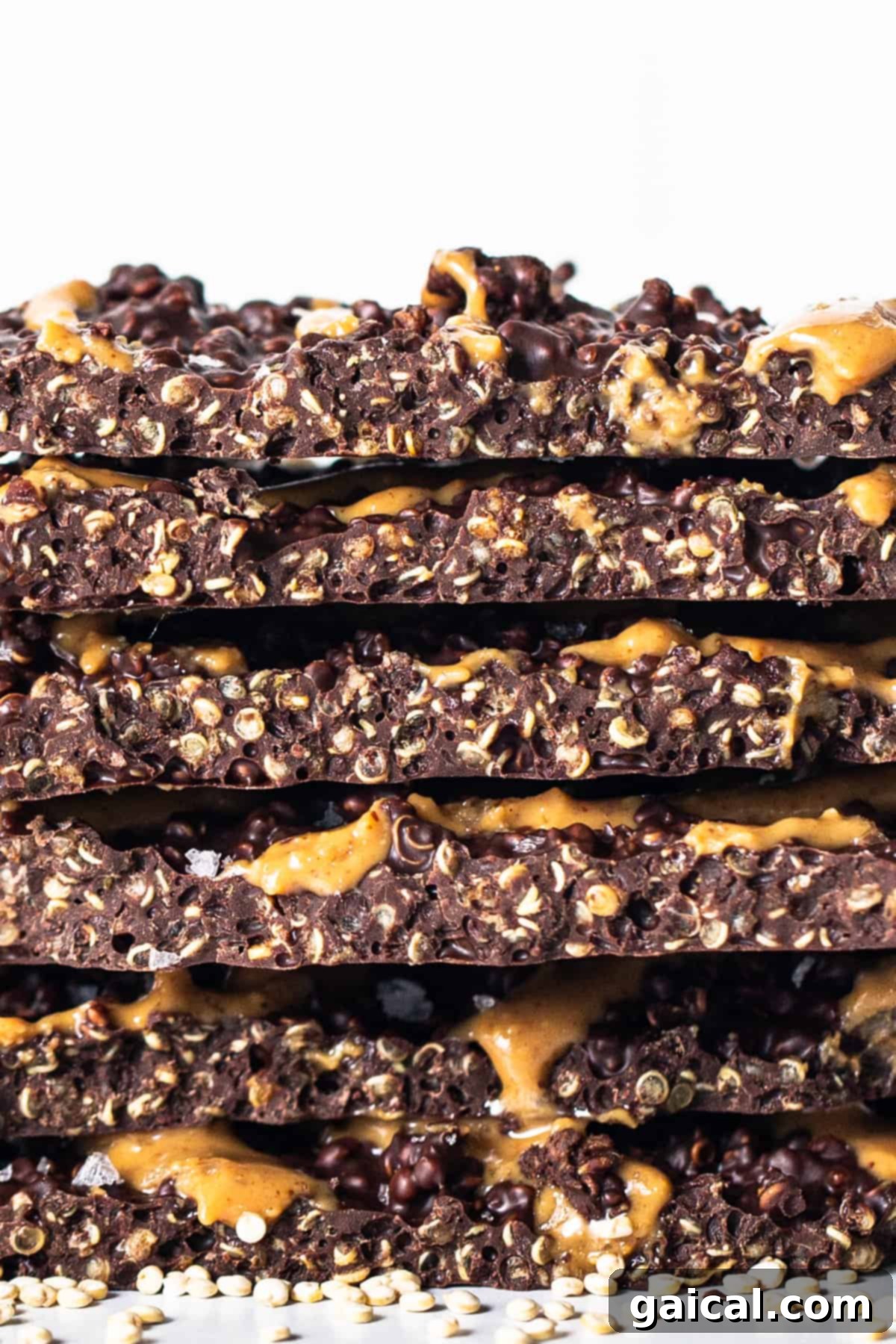 A stack of delicious chocolate and caramel granola bars, inspiring ideas for similar textured, healthy, and easy-to-store treats.