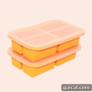 A stack of orange silicone freezing trays, perfect for single-serve portions of soup.