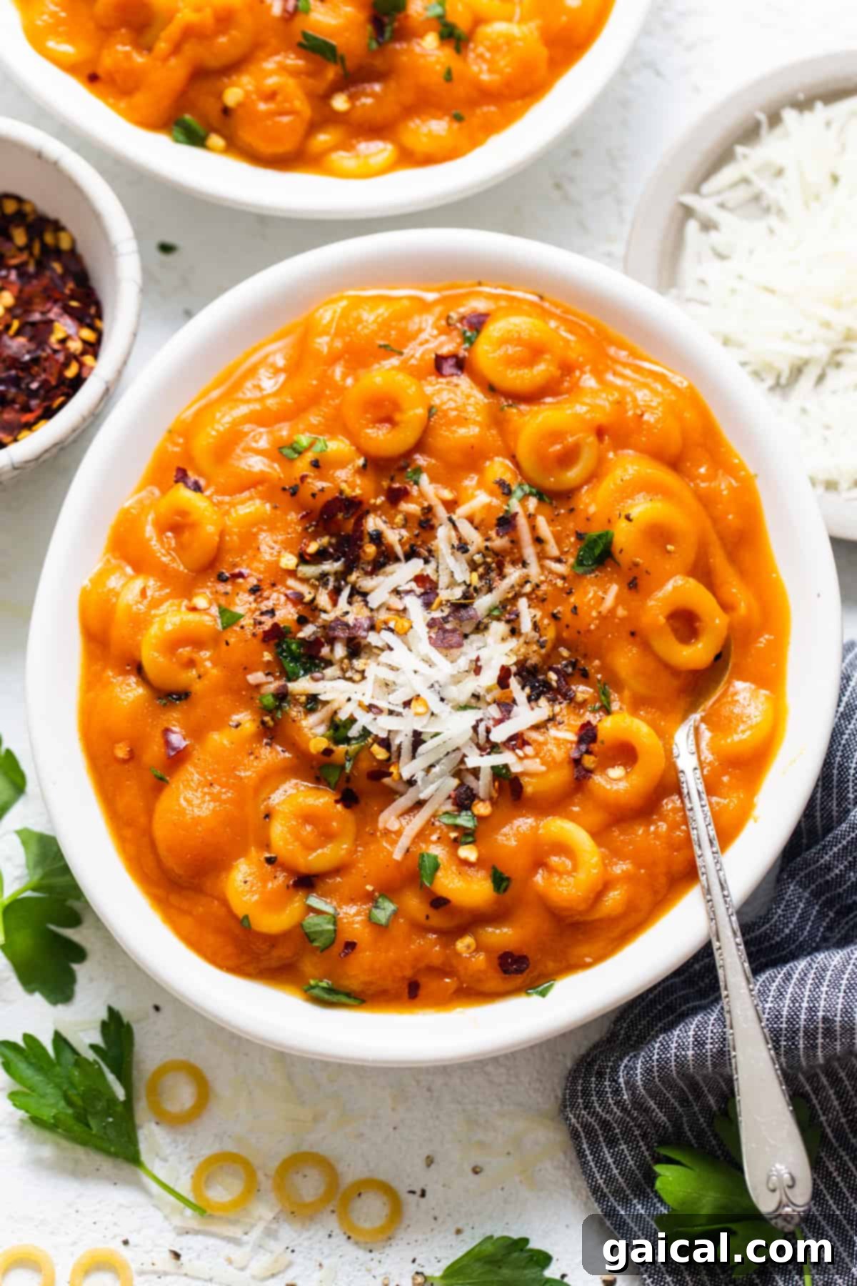 Stealthy One-Pan Spaghettios 6 two bowls of macaroni and cheese soup on a table.
