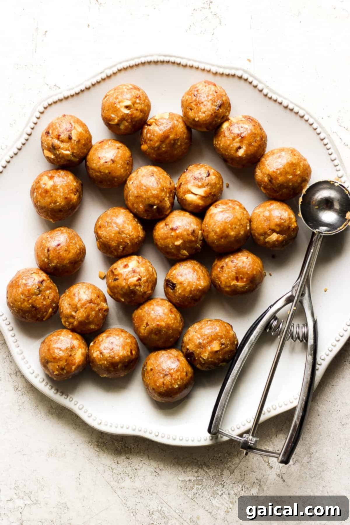 Autumn's Wholesome Kitchen Collective 6 Perfectly formed peanut butter balls arranged on a plate, ready to be enjoyed as a healthy snack.