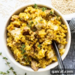 A bowl of rice with meat and thyme, ready to serve.