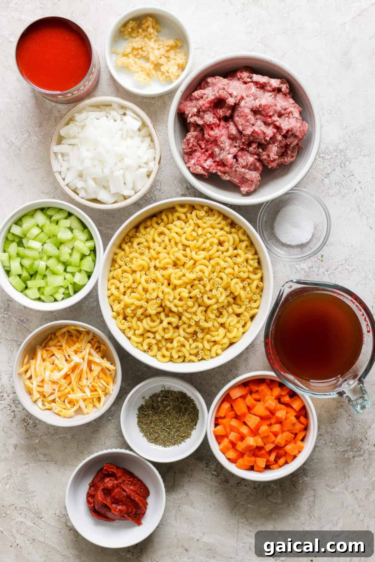 Skillet Ground Beef Pasta 3 Fresh ingredients for homemade Instant Pot Hamburger Helper displayed neatly in white bowls on a white background.