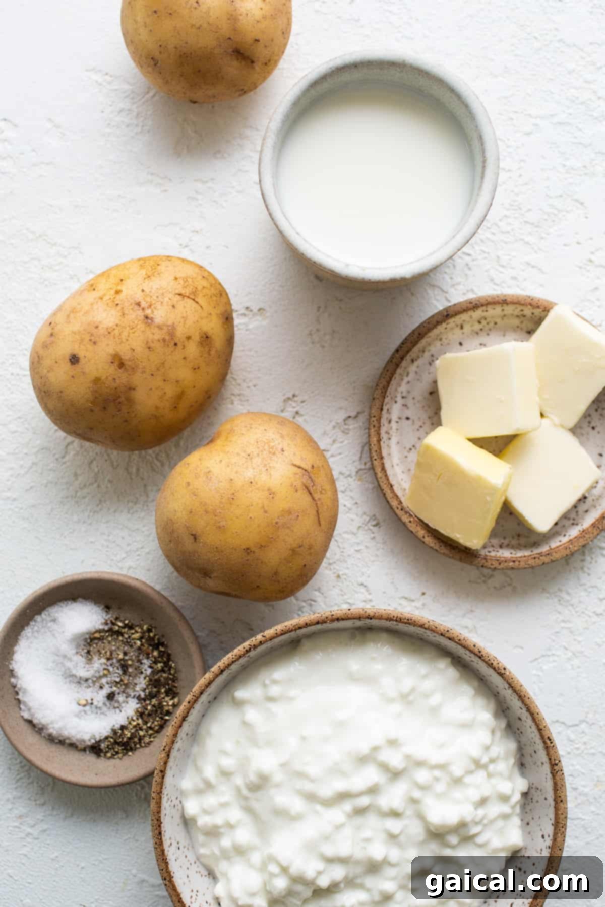Nourishing November Fit Foodie Culinary Adventures 4 A beautifully arranged selection of fresh Yukon gold potatoes, butter, salt, and seasonings, ready for making whipped cottage cheese mashed potatoes.