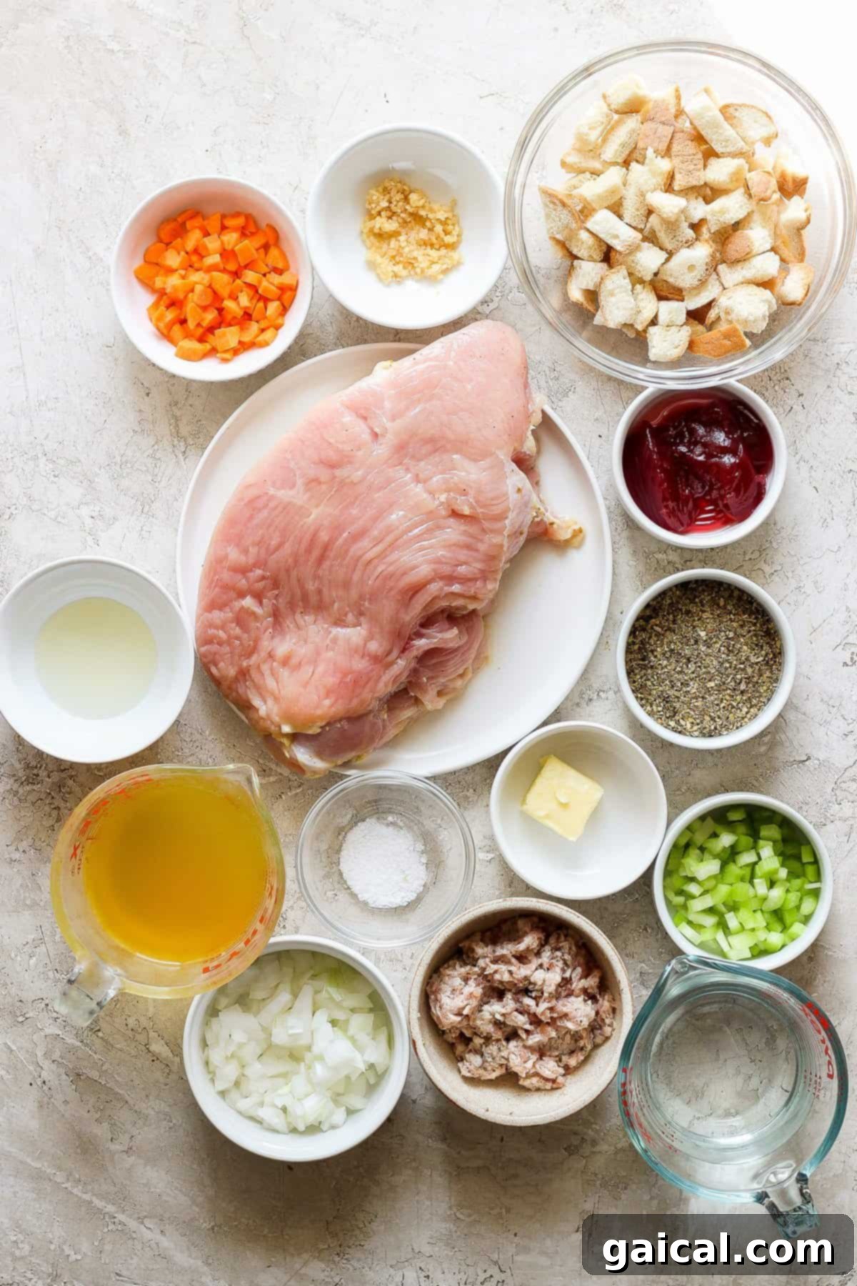 Festive Turkey Roulade with Hearty Italian Sausage Stuffing 3 An array of fresh ingredients including turkey breast, herbs, spices, and cranberries, ready for preparing a festive turkey roulade.