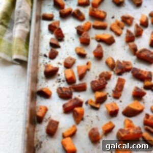 Roasted sweet potatoes on a baking sheet.