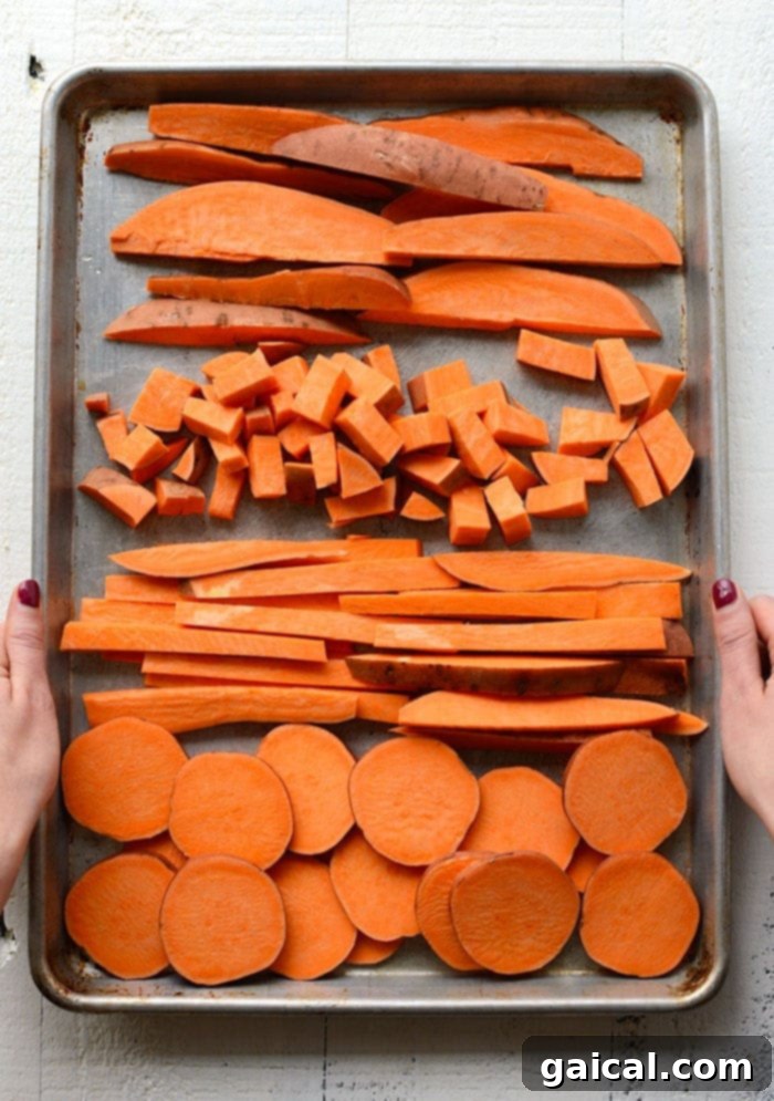 A variety of sweet potato cuts: wedges, cubes, fries, and rounds, ready for roasting.