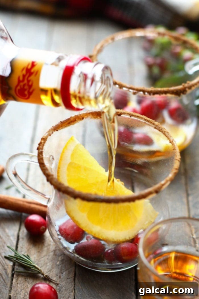 pouring whiskey into a cup