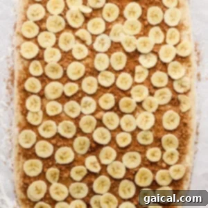 Nutty Brown Butter Banana Bread Cinnamon Rolls 10 Dough rolled into a large rectangle on a lightly floured surface, ready for filling.