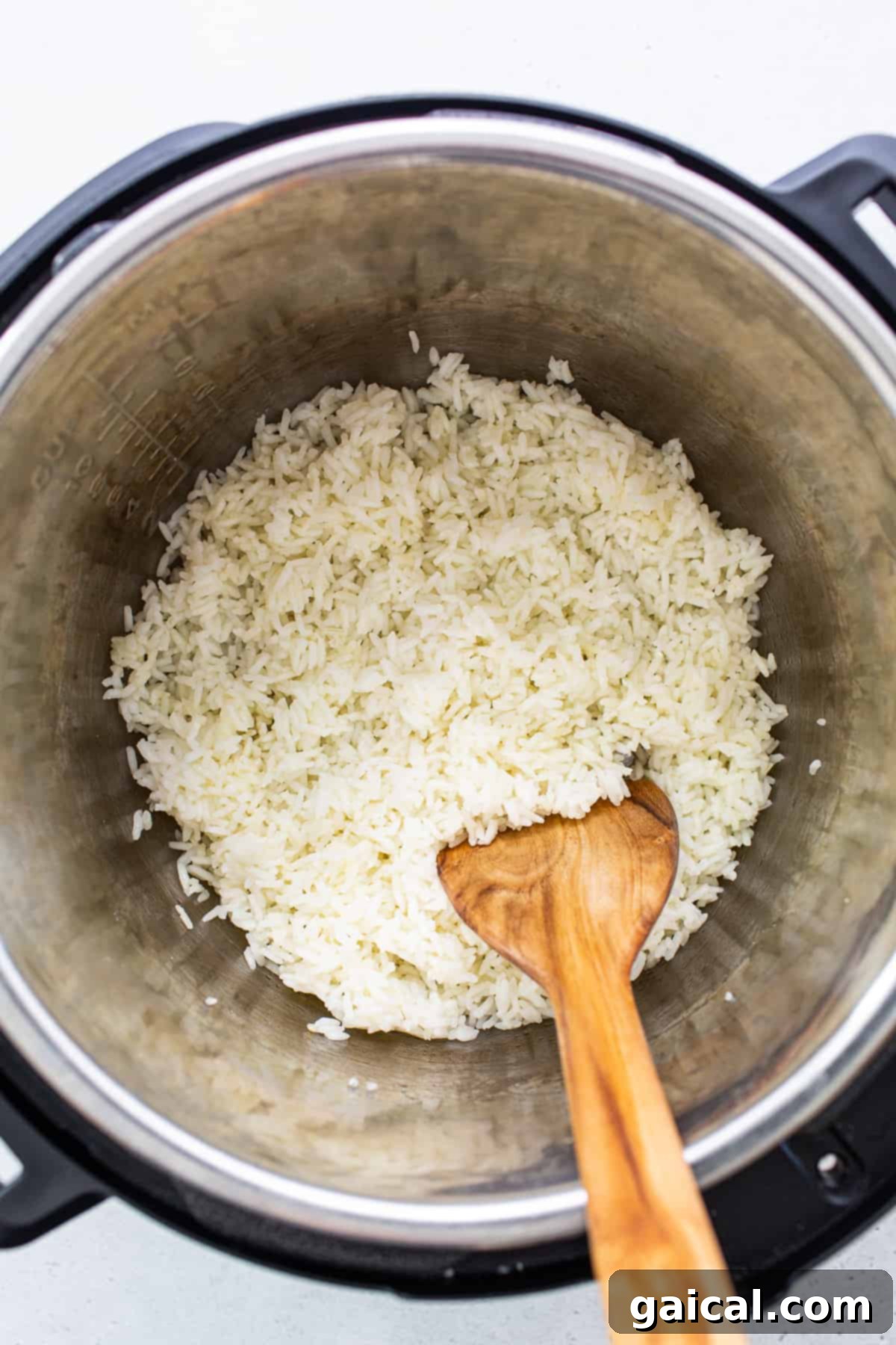 Fluffed white rice inside an Instant Pot, freshly cooked.