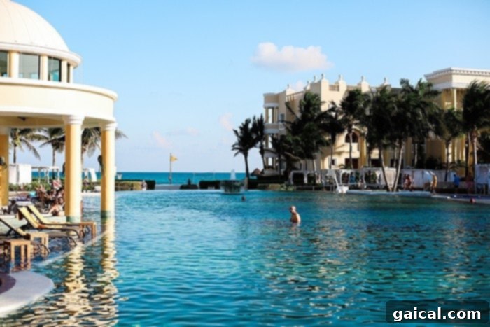 A vibrant pool area at Iberostar Grand Hotel Paraíso, perfect for relaxation and fun.
