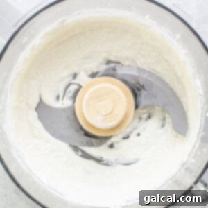 Blended cottage cheese in a food processor.