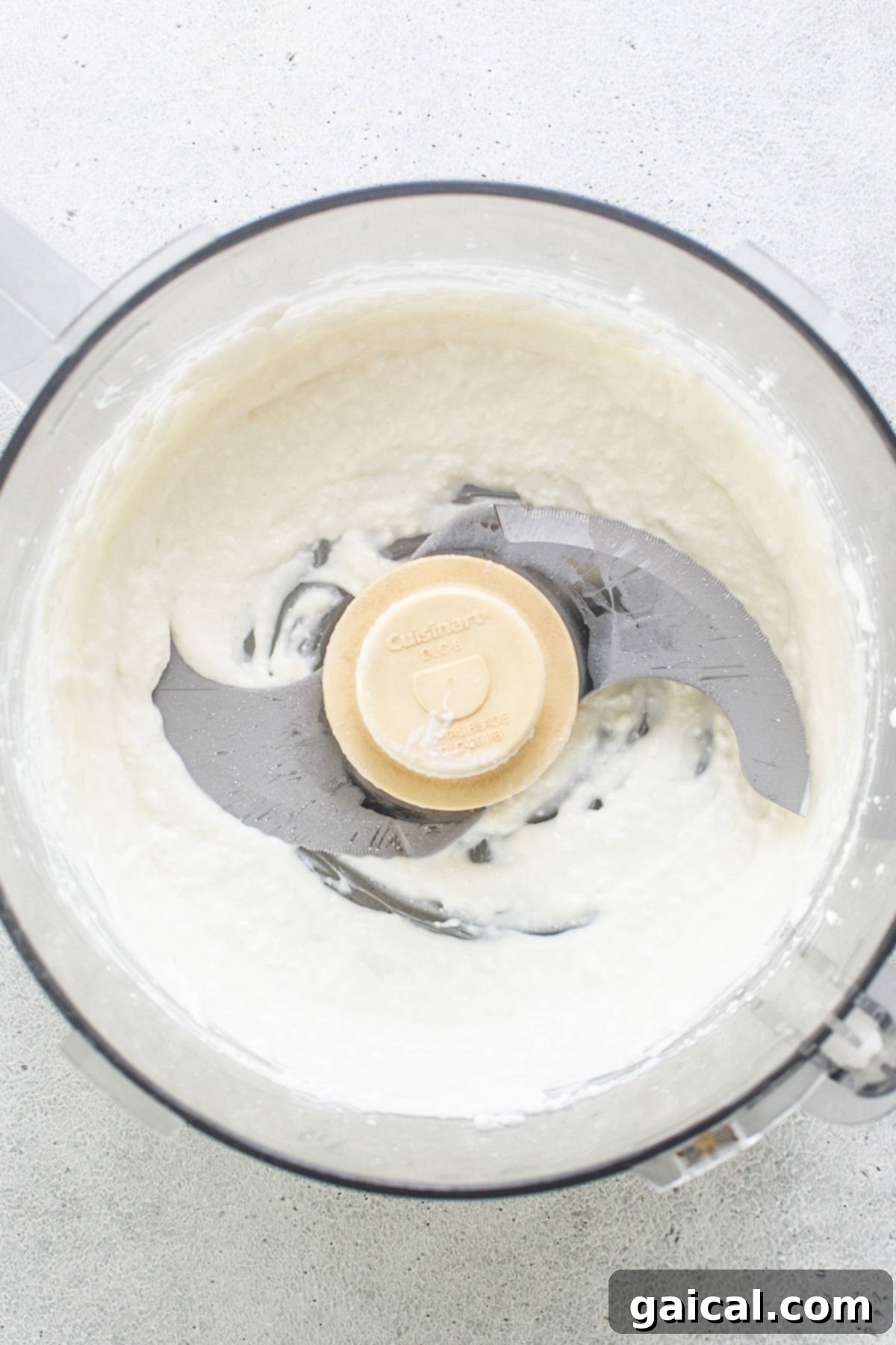 Protein-Boosted Banana Bread 4 Blended cottage cheese in a food processor, ready to be added to the banana bread batter.