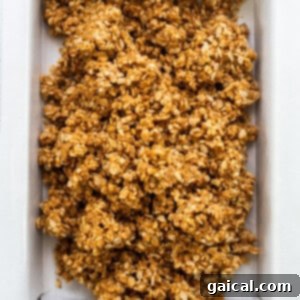 A box of granola in a white box, representing the rice crispies used in the recipe.