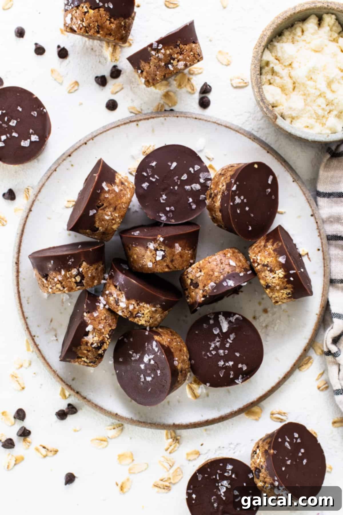 Healthy Protein Cookie Dough Bites 7 A plate topped with finished chocolate covered granola bars, ready to be enjoyed.