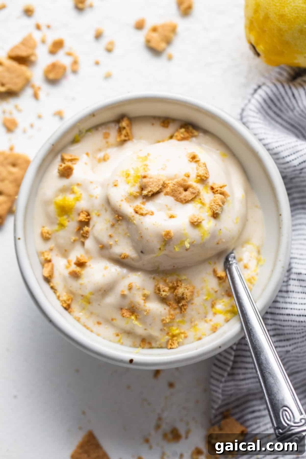 Sunshine Lemon Cheesecake Nice Cream 7 A beautifully presented bowl of Lemon Cheesecake Nice Cream, ready to be enjoyed with a spoon.