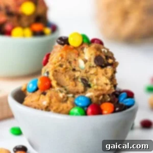 A bowl filled with cookies and m&m's.