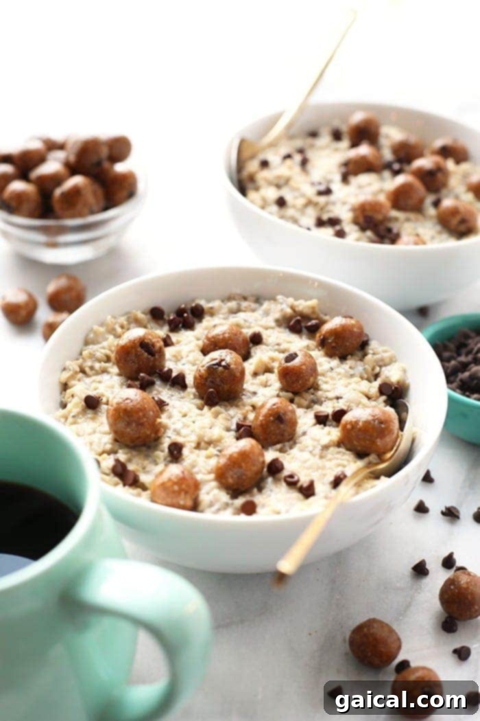A beautifully styled bowl of Chocolate Chip Cookie Dough Oatmeal, garnished with mini chocolate chips and a drizzle of maple syrup.