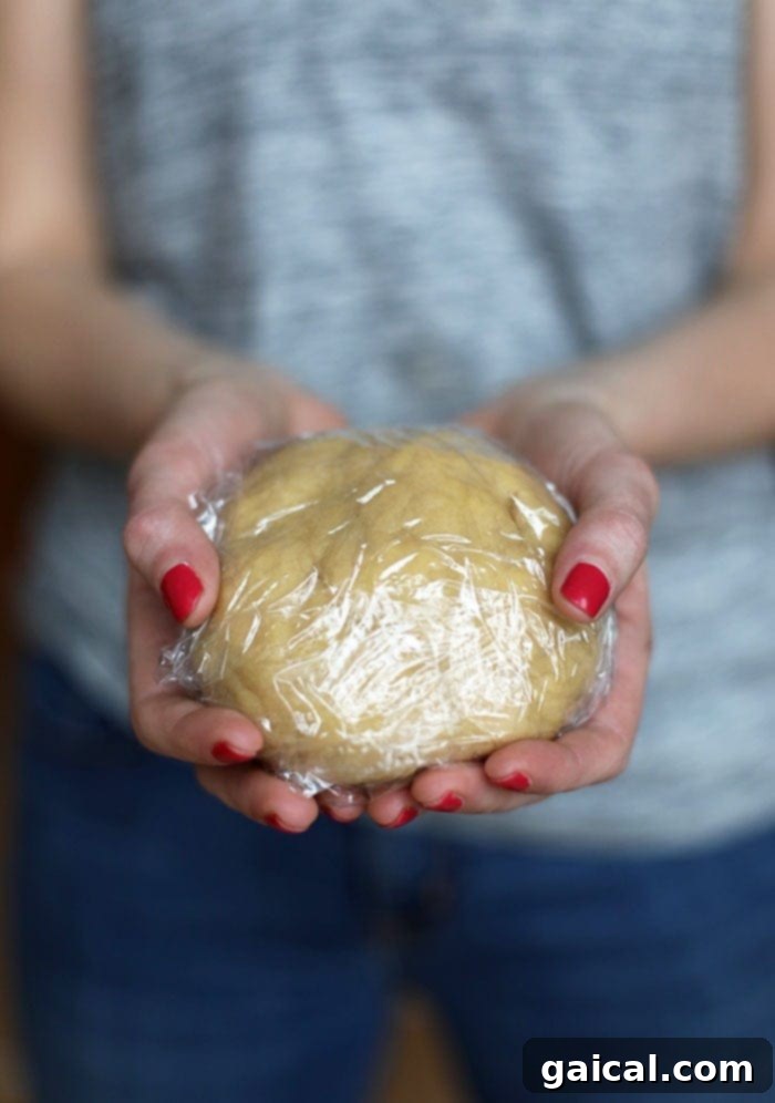 These healthy gluten free cookies are made with almond meal and honey for a grain-free, paleo-friendly sugar cookie! Make a batch today! Sugar cookie dough ready for rolling