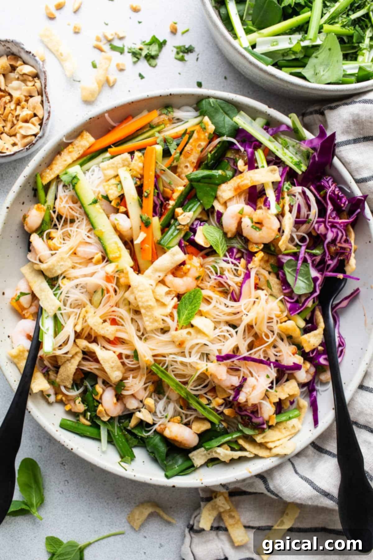 Fresh Spring Roll Bowl 5 A rustic, artistic shot of a bowl of Asian noodle salad, generously topped with an abundance of chopped peanuts and fresh, vibrant vegetables, capturing its texture and appealing composition.