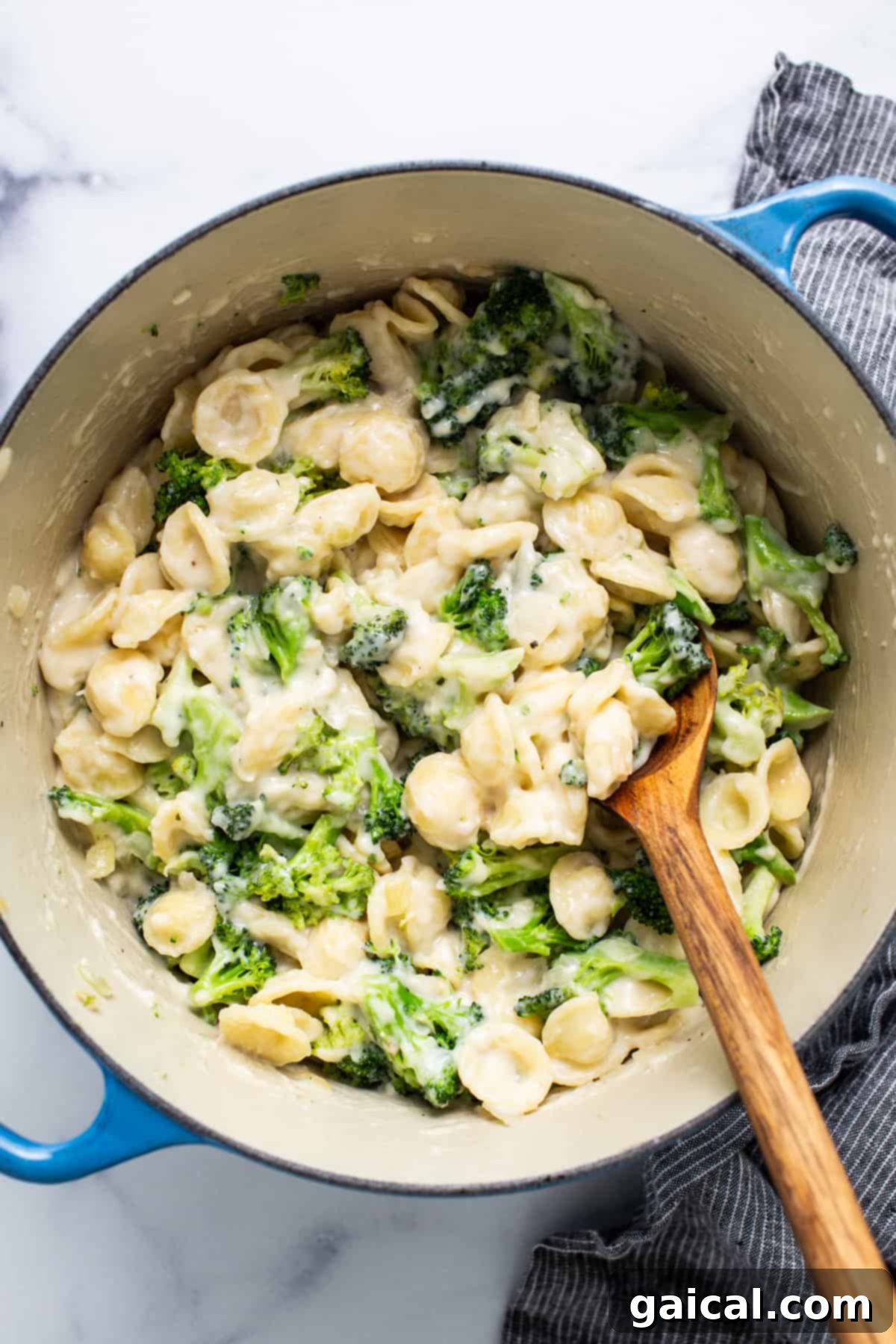 Velvety Broccoli Pasta 4 A pot of pasta with broccoli and cheese in it, freshly mixed.