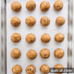 Peanut butter balls on a baking sheet.