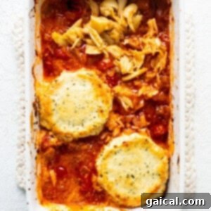 A casserole dish with chicken and pasta in it.