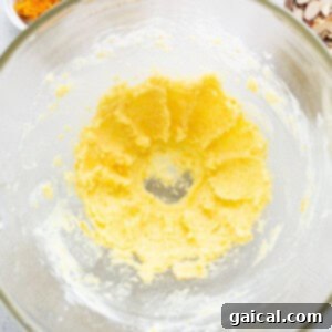 Sun-Kissed Orange Cake 11 A glass bowl filled with ingredients for a recipe.