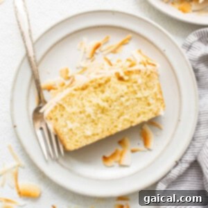 Sun-Kissed Orange Cake 5 coconut loaf on plate.