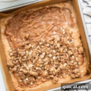 Spiced Carrot Coffee Cake 10 A baking pan filled with granola and granola, freshly topped with streusel and ready for the oven.