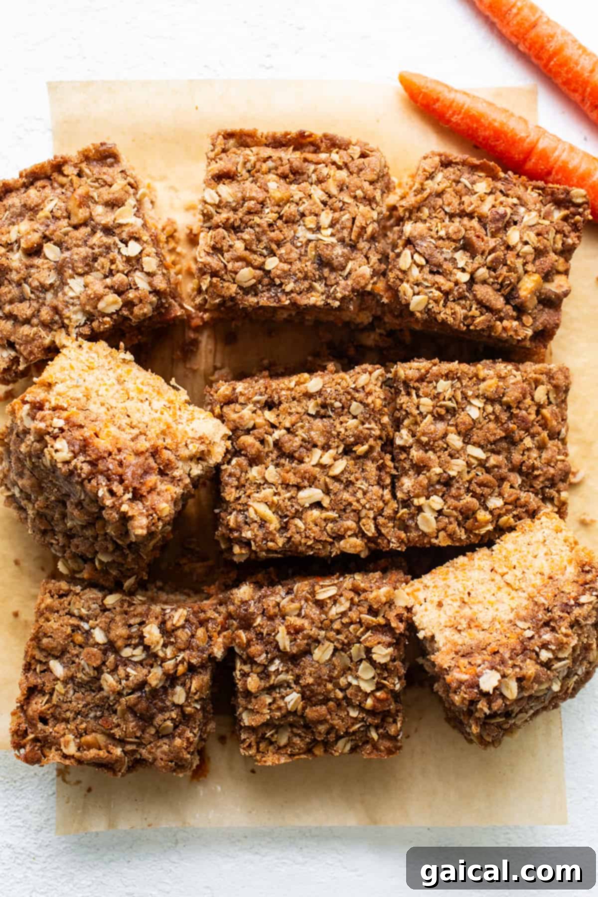 Spiced Carrot Coffee Cake 5 Carrot bars with oats and carrots on a cutting board, garnished with fresh mint.