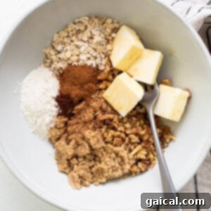 Spiced Carrot Coffee Cake 8 Oats, cinnamon, butter and sugar in a bowl, being mixed for streusel topping.