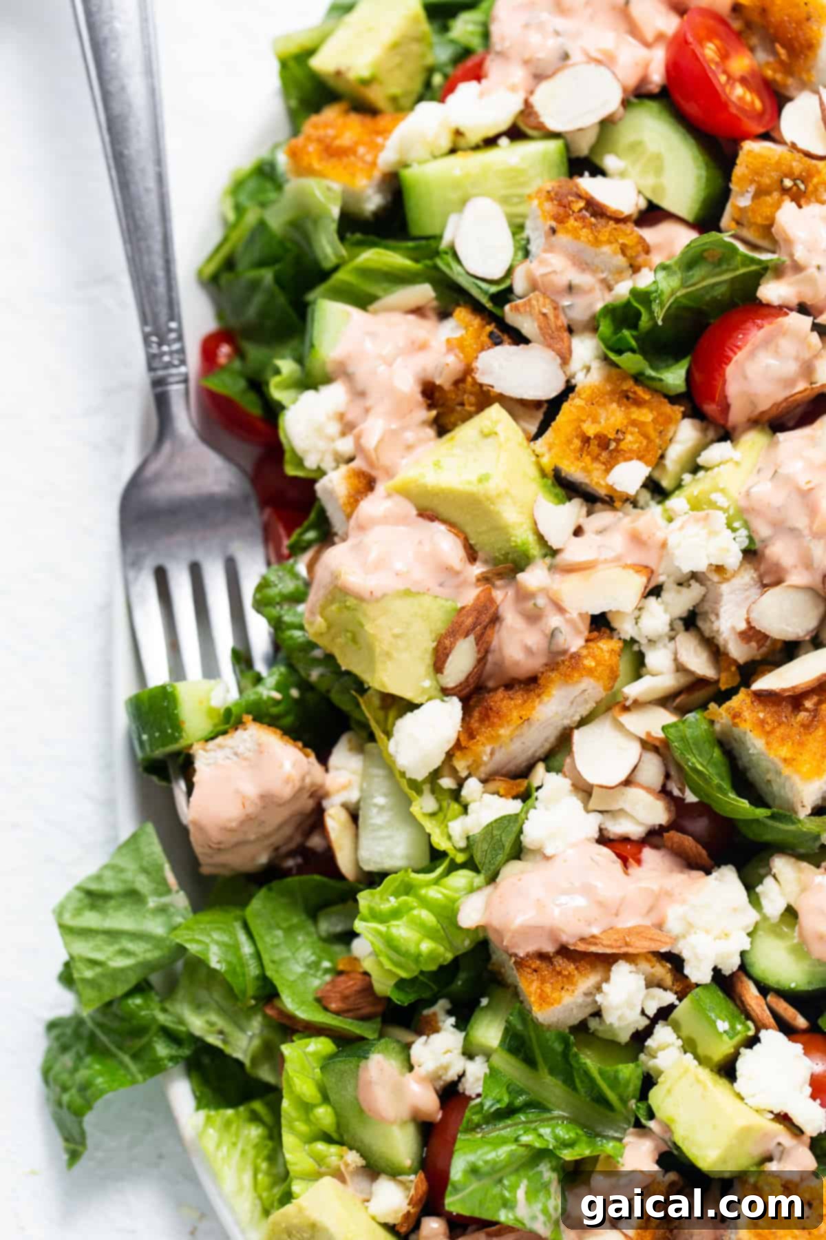 Perfect Homemade Thousand Island Dressing 2 A vibrant salad featuring crispy chicken, fresh tomatoes, and creamy avocado, perfectly dressed with Thousand Island.