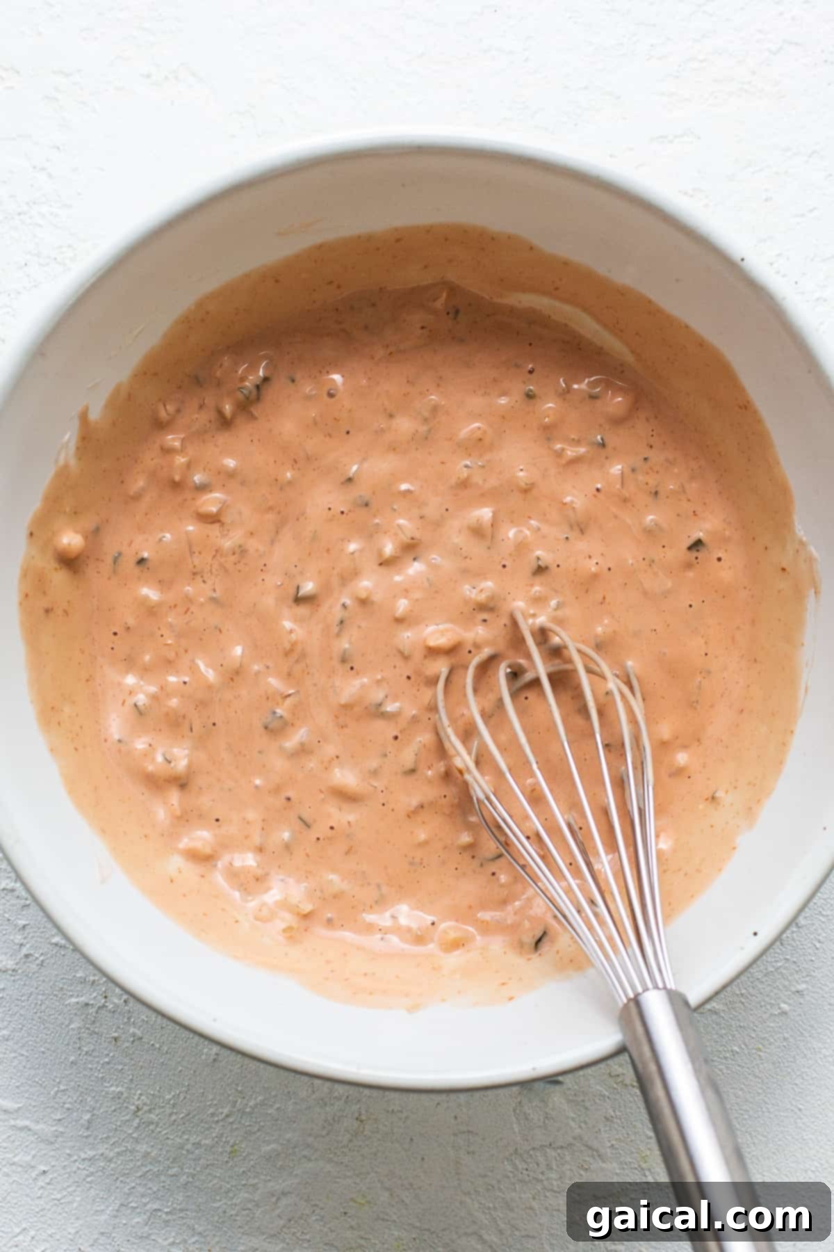 Perfect Homemade Thousand Island Dressing 4 A close-up shot of the freshly made Thousand Island dressing in a bowl, ready for serving.