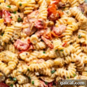 Creamy pasta salad with shrimp and diced vegetables.