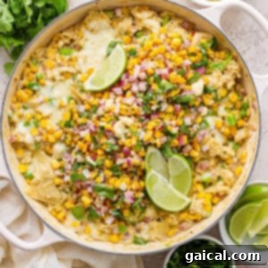 Mexican corn enchiladas in a skillet, freshly topped with cilantro and cotija.