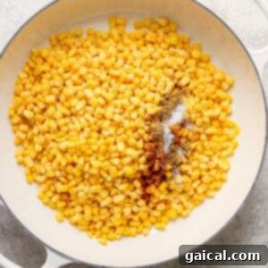 Corn on the cob in a white pan, caramelized.