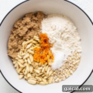 A bowl with ingredients for a pumpkin bread.