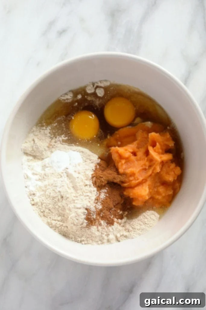 Sweet Potato Power Pancakes 4 A bowl containing all the dry and wet ingredients for sweet potato pancakes before mixing.