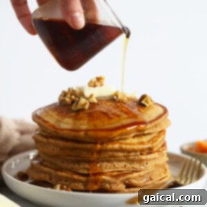 Sweet Potato Power Pancakes 7 Stack of healthy sweet potato pancakes on a plate, ready to be served.