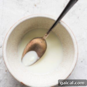Zesty Coconut Key Lime Frozen Treats 9 Melted white chocolate and coconut oil in a bowl, stirred smooth.