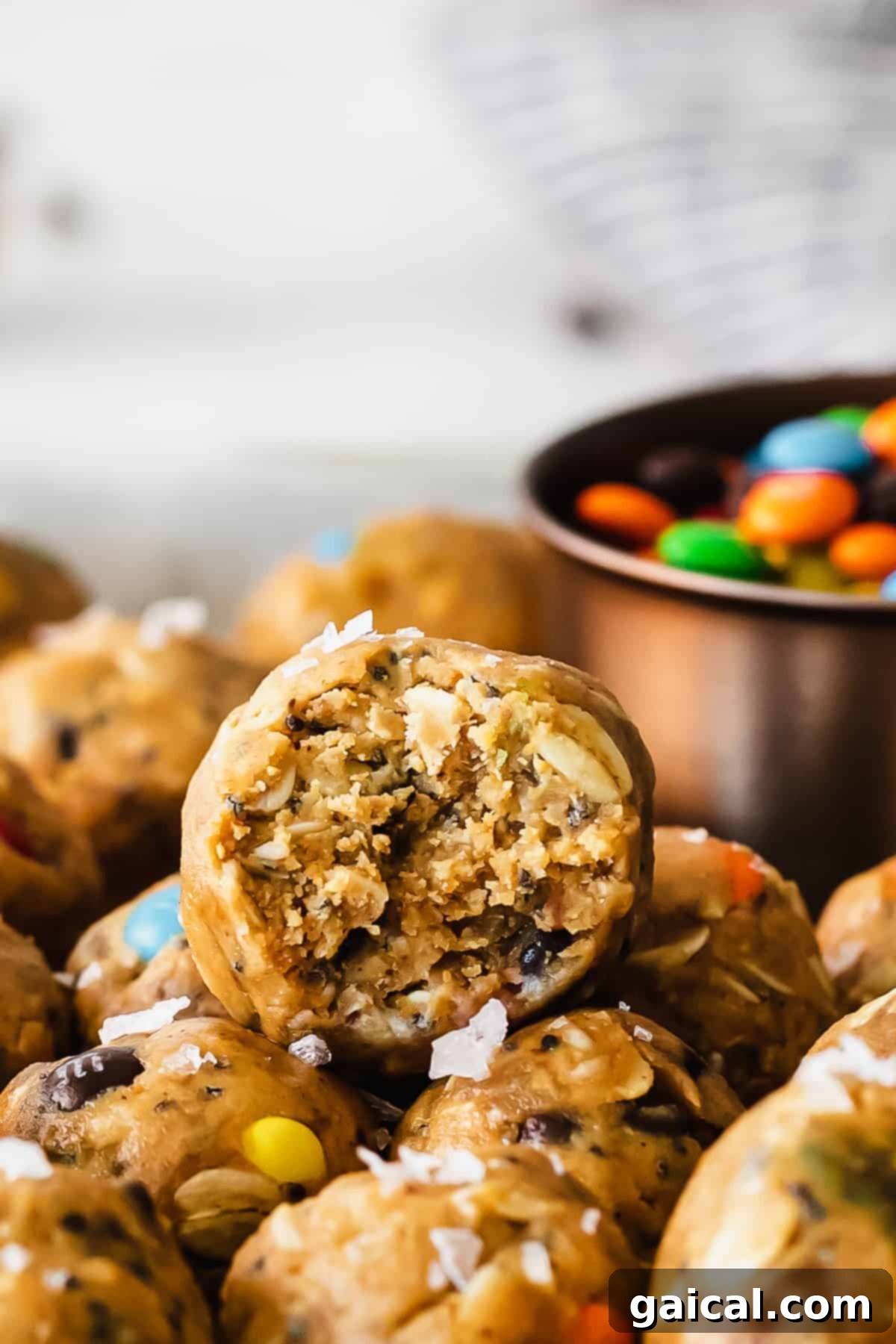 Oatmeal cookie bites with a bite taken out of them.