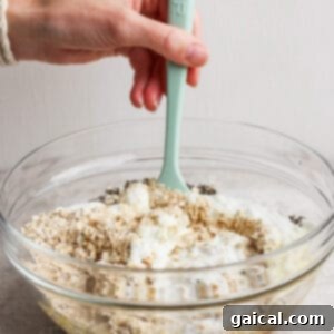 A bowl with all the combined ingredients for overnight oats, mixed and ready for chilling.